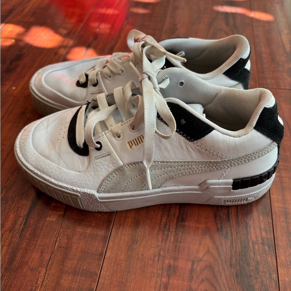 Puma White Sneakers with Black and Gold Accents